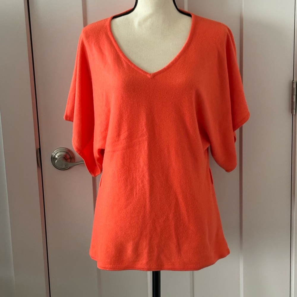 Orange v-neck sweater. Flowing sleeves and hip length.  Soft material.  Size S-M